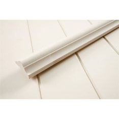 White quarter-round baseboard molding laid on a light floor.