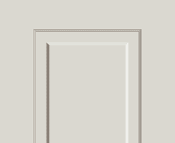 Interior doorway with layered beige frames on a light beige wall, showing decorative molding surrounding a white inset panel.